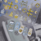 Detailed view of gold Christmas nail decals featuring intricate designs of snowflakes, reindeer, stars, wreaths, and "Merry Christmas" text on a clear backing, shown with elegant gold and white winter press-on nails.